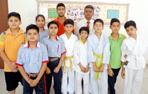 Selected Karatekas of GD Goenka Public School posing for a group photograph.