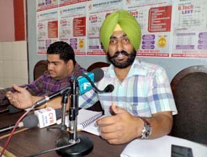 Er Jarmanjit Singh Sandhu Dean, Training and Placement Adesh Group addressing media persons on Thursday.