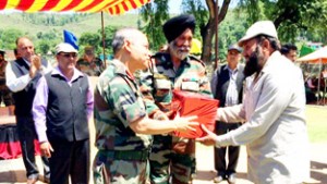 An Ex-serviceman being felicitated by GOC 16 Corps during Veterans rally at Mendhar on Wednesday. 