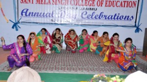 Students presenting a colourful cultural item while celebrating Annual Day at Sant Mela Singh College of Education on Thursday.