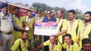 Winners of Kabaddi title being presented a cheque and trophy at DPL Rajouri on Friday.