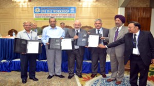 VCs of three Central Universities and Vice-Chairman UGC displaying copies of MoU.