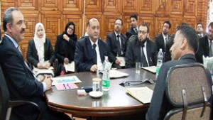 Justice Ali Mohammad Magray chairing a meeting at Srinagar on Saturday.