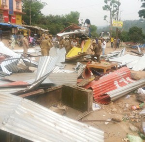 Structures smashed by Forest Department team on Monday.