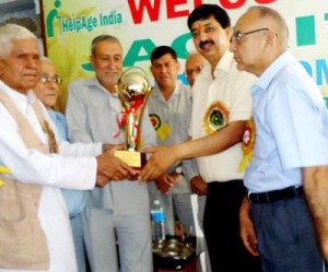 Minister of State for Finance, Pawan Kumar Gupta being honoured by Jagriti Old Age Home at Udhampur on Sunday.