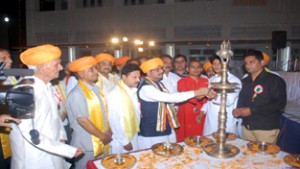 Former Minister Gulchain Singh Charak, inaugurating a spiritual programme at Gandhi Nagar in Jammu.