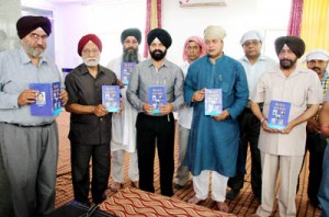 MLA Jammu East, Rajesh Gupta and other dignitaries releasing a book in Punjabi on Sunday.