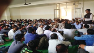 Former Minister, Gulchain Singh Charak addressing a meeting of party workers at Bishnah.