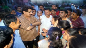 Film maker Ashok Pandit interacting with Kashmiri migrants at Jagti on Tuesday.