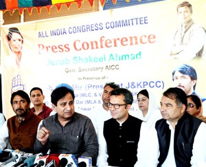 All India Congress Committee (AICC) General Secretary Shakeel Ahmad with Jammu and Kashmir Pradesh Congress Committee chief Ghulam Ahmad Mir  and senior Congress leader Salman Soz addressing a press conference in Srinagar on Wednesday.    -Excelsior/Amin War