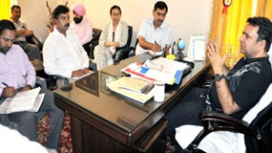 Minister for CAPD Ch Zulfkar Ali chairing a meeting at Jammu on Sunday.