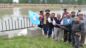 Joint Director Tourism, Tasaduq Hussain flagging off Jhelum River cruise at Srinagar on Tuesday.