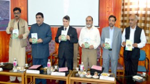 Dignitaries releasing a book during seminar on Sheikh Hamzah Makhdoom on Tuesday.