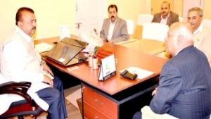 Minister for Industries, Chander Prakash chairing a meeting at Srinagar on Monday.