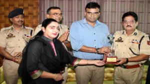 IGP Jammu Zone Danish Rana presenting memento to DIG Jammu Shaked Ahmed Beig during farewell function at RPHQ, Jammu on Thursday.