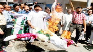 Activists of Jammu West Assembly Movement burning Pak flag and raising anti-Pak slogan on Saturday.