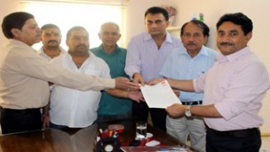 A delegation of HRA Katra submitting a memorandum to Project Director, NHAI, R P Singh at Jammu on Tuesday.