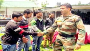 Army officer interacting with youth undergoing training for TCS interviews at Baramulla. -Excelsior/Aabid Nabi