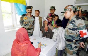 A female doctor along with Army personnel during a medical camp at Drabgam in Pulwama district.