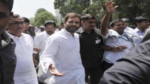 Congress Vice President Rahul Gandhi sits on dharna with agitating civic workers of East Delhi Municipal Corporation demanding the payment of their wages in New Delhi on Friday. (UNI)