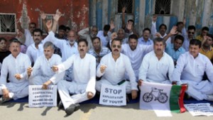 NPP leaders sitting on dharna in protest against failure of BJP-PDP coalition Govt. — Excelsior/Rakesh