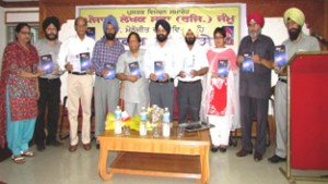 Dignitaries during a book release function at K L Saigal Hall, Jammu on Saturday.