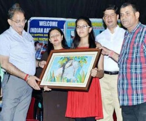 Speaker J&K Assembly Kavinder Gupta at painting exhibition in Jammu on Tuesday.