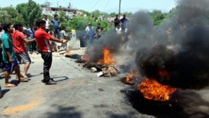 People protesting against land encroachment at Garhi on Monday. 