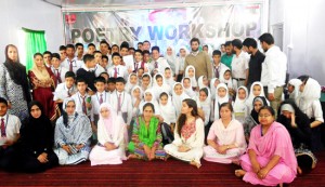 Participants of poetry workshop organised by Army Goodwill School, Aitmul, Bandipora posing for group photograph.