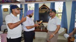 Principal Sainik School Nagrota Colonel KD Koushal presenting souvenir to DC Jammu Simrandeep Singh.