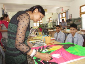 Artist busy in painting during the second day of painters camp at Rajouri
