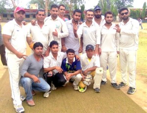 Eleven Stars Akhnoor posing for group photograph after winning match during Summer Cup T-20 Cricket Tournament at Akhnoor on Wednesday.