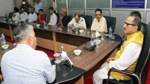 Deputy Chief Minister, Dr Nirmal Singh reviewing functioning of Central University in a meeting on Saturday.