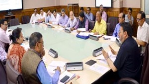 Minister for R&B Syed Mohammad Altaf Bukhari reviewing progress of highway upgradation in a meeting at Srinagar on Tuesday.