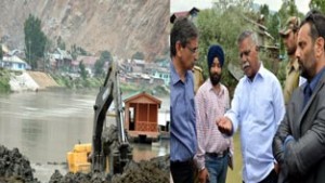 Minister for Revenue, Javid Mustafa Mir flanked by Minister for PHE, Sukhnandan Kumar Choudhary inspecting breach sites of river Jehlum on Tuesday.