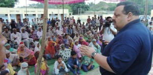 Provincial President of National Conference Devender Singh Rana addressing public gathering in Nagrota constituency on Tuesday. 