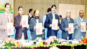 Minister for Forests, Bali Bhagat and others releasing reports on land use mapping at Srinagar on Friday.