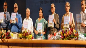 MoS Education Priya Sethi and others releasing souvenier of conference at SMVDU on Wednesday.