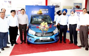 JKB Vice President Arvind Gupta and others at the launch of Maruti’s Celerio at Peaks Auto on Tuesday. -Excelsior/ Rakesh