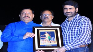 MLA Reasi Ajay Nanda being felicitated by Natrang Director Balwant Thakur and the President Reasi Theatre Organisation, Sunit Kumar.