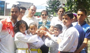 Young Taekwondo players being felicitated by NGO ‘Jiyo Aur Jeene Do’ at Batamaloo in Srinagar.