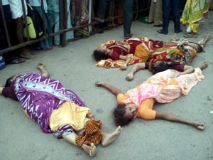 Bodies of victims lie near a bathing ghat  following a stampede that took place during Godavari Maha Pushkaram, in Rajahmundry on Tuesday. (UNI )