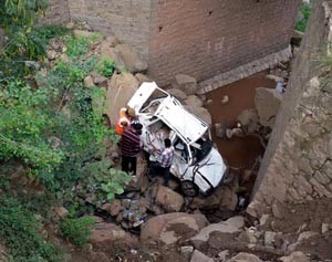 Badly damaged car which fell into gorge near Dharmthal on Wednesday.