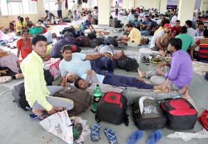 Stranded Amarnath yatris taking rest at Bhagwati Nagar Yatri Niwas on Sunday.   —Excelsior/Rakesh