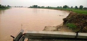 Overflooded Basanter river causes destruction in Ramgarh on Friday. -Excelsior/Gautam