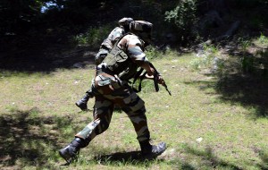 Army jawans in action during encounter in Uri on Friday.  -Excelsior/ Aabid Nabi