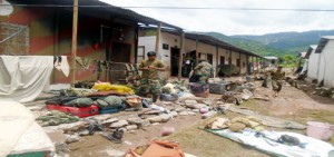 Army jawans collecting their belongings after cloudburst hits Army unit, washing away barracks and bunkers at Chhatral in Mendhar on Firday.