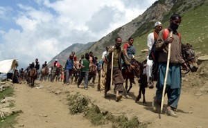 Pilgrims on way to holy cave on Sunday.— Excelsior/Sajad Dar