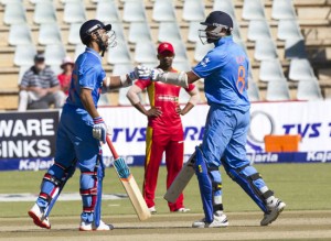 Ajinkya Rahane and M Vijay celebrating 112 runs opening partnership in second ODI against Zimbabwe at Harare on Sunday.