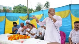 Senior BJP leader Yudhvir Sethi addressing a function at General Bus Stand Jammu on Monday.